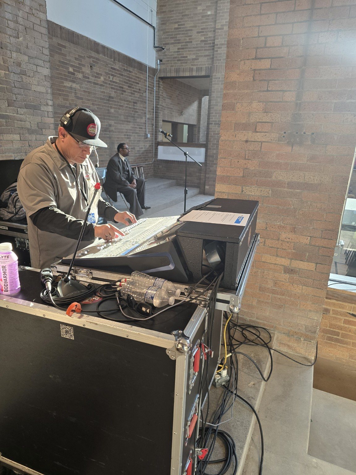 Oscar Rivera operating a professional front of house mixing console