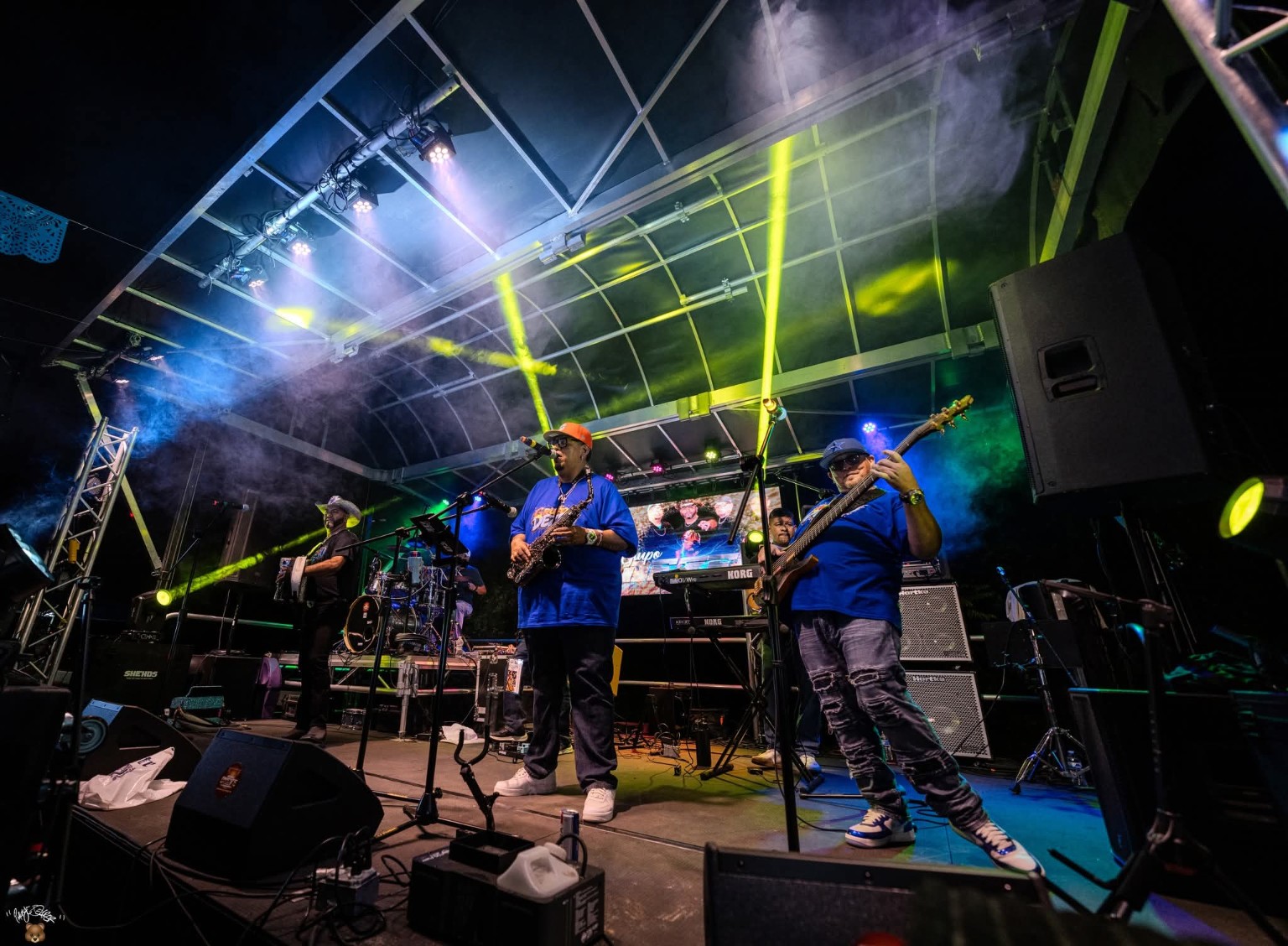 Live band on stage under intelligent lighting