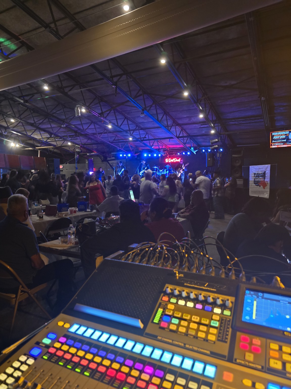 Front of house view over a busy indoor live event